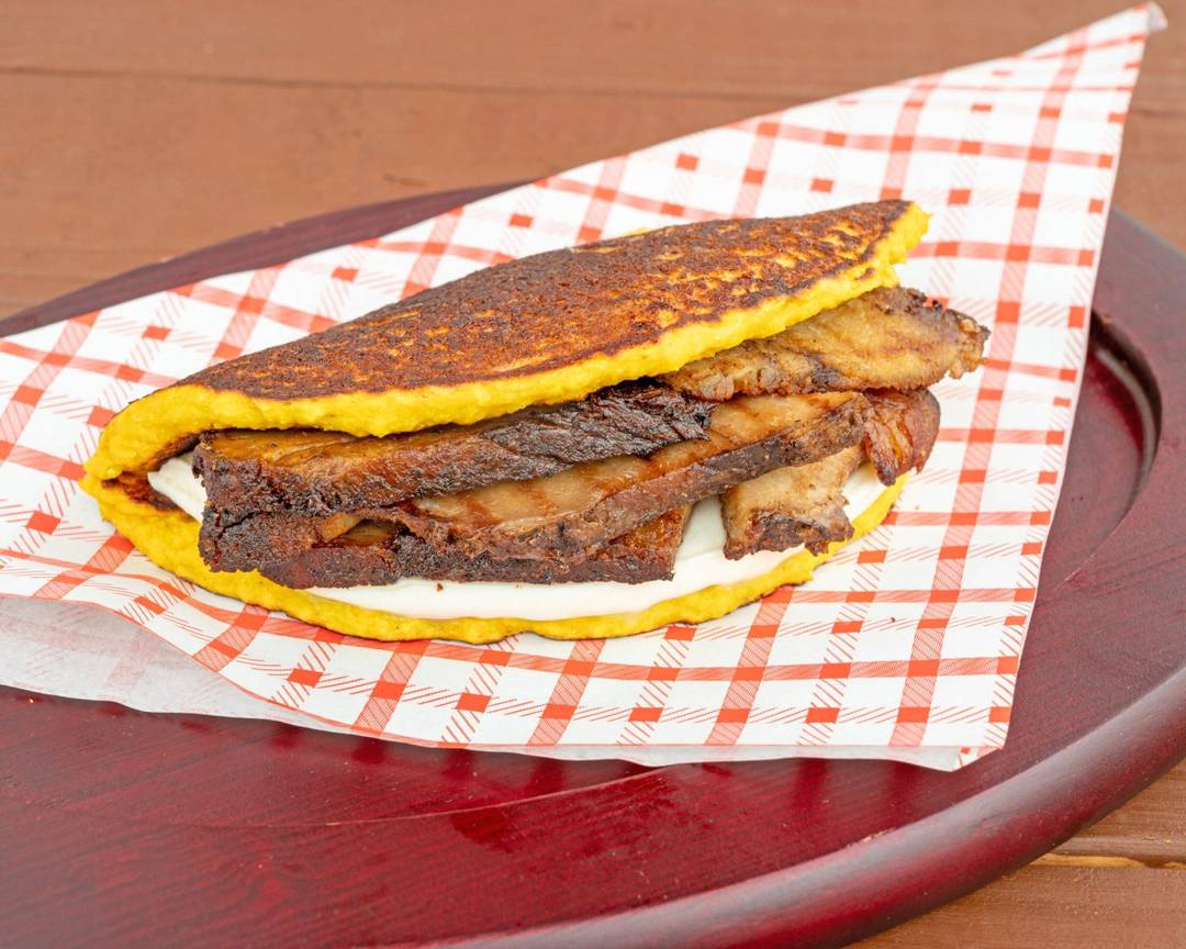 Cachapa with roasted pernil and queso de mano